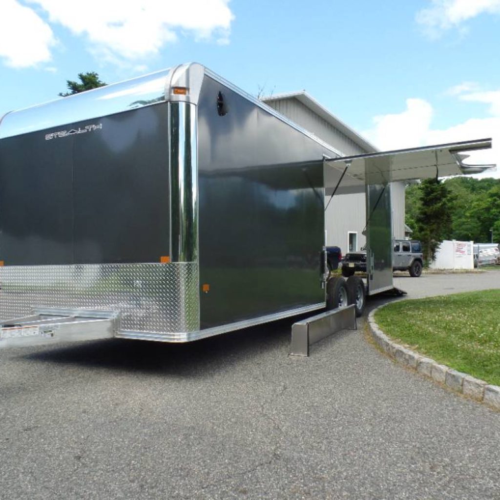 8-5x24-all-aluminum-frame-car-trailer-with-big-escape-door-removable-fender, 9,990 GVWR Torflex Axles, White walls + ceiling, aluminum rims.