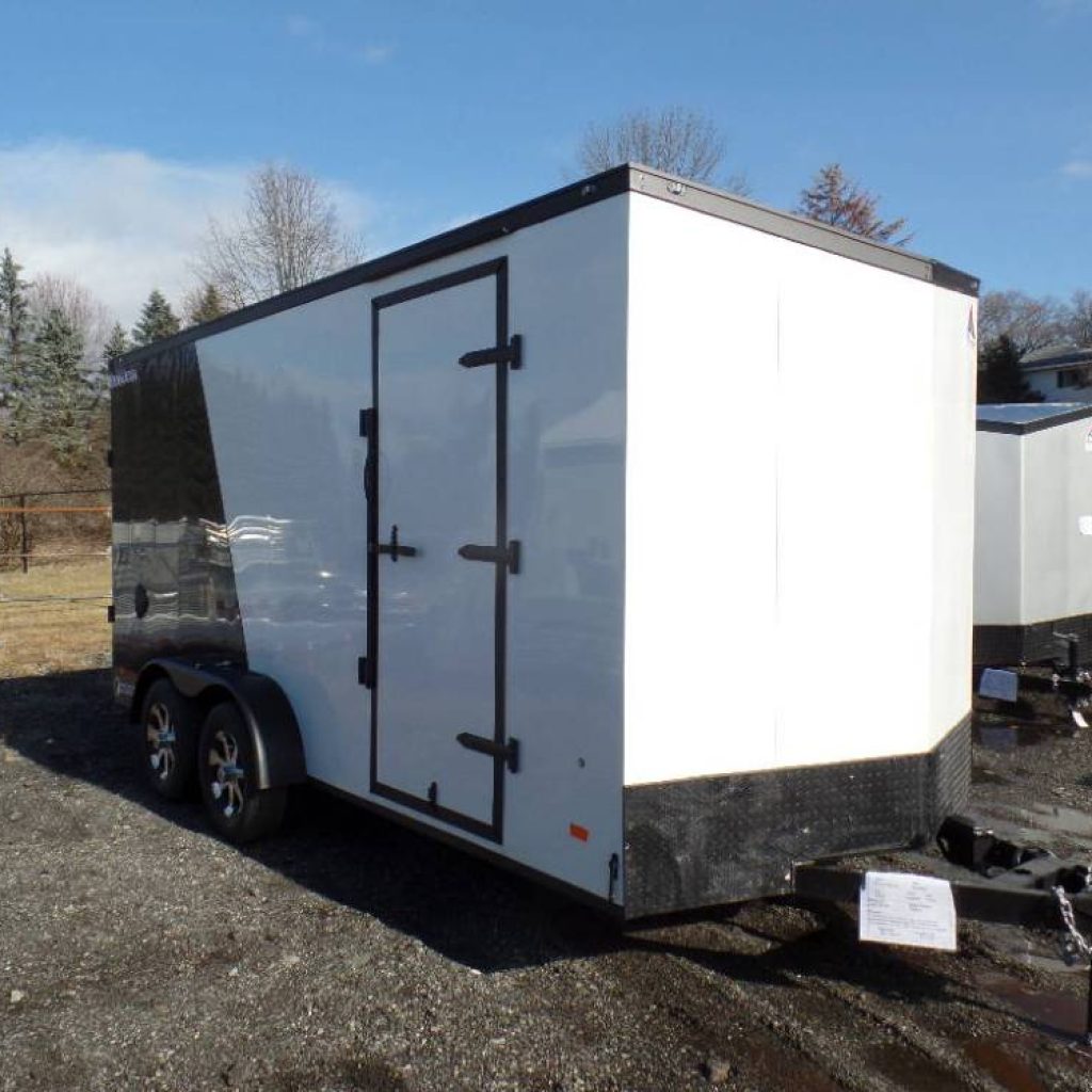 7X16 Enclosed Cargo Trailer, 7 ft. Interior Height, Two tone Exterior, Black Out Trim Appearance Package, Ramp Door, side door.  7,000 lb. GVWR , 2,400 lbs. empty weight.