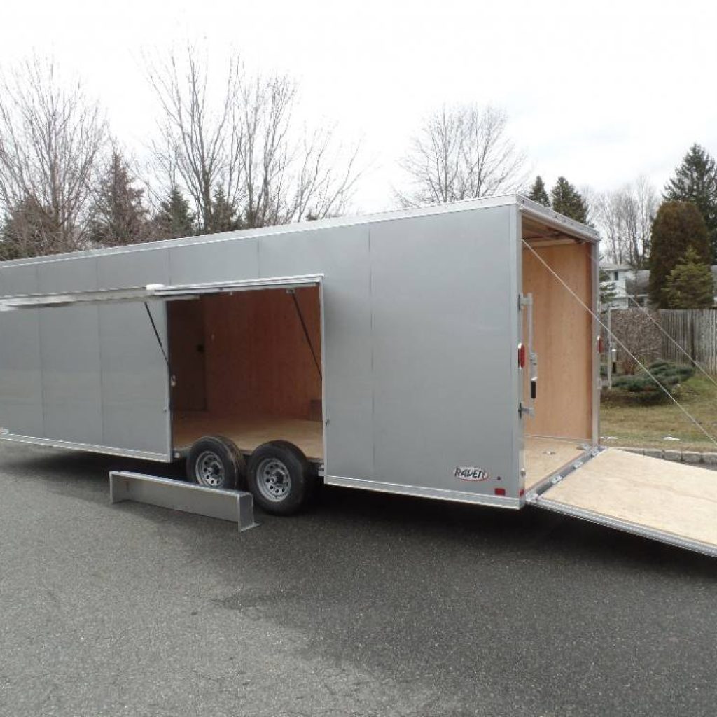 BEST Way to load a car in an enclosed trailer. Big Escape door with removable fender allows easy exit and entry to car inside the trailer. ATC all aluminum frame trailer.