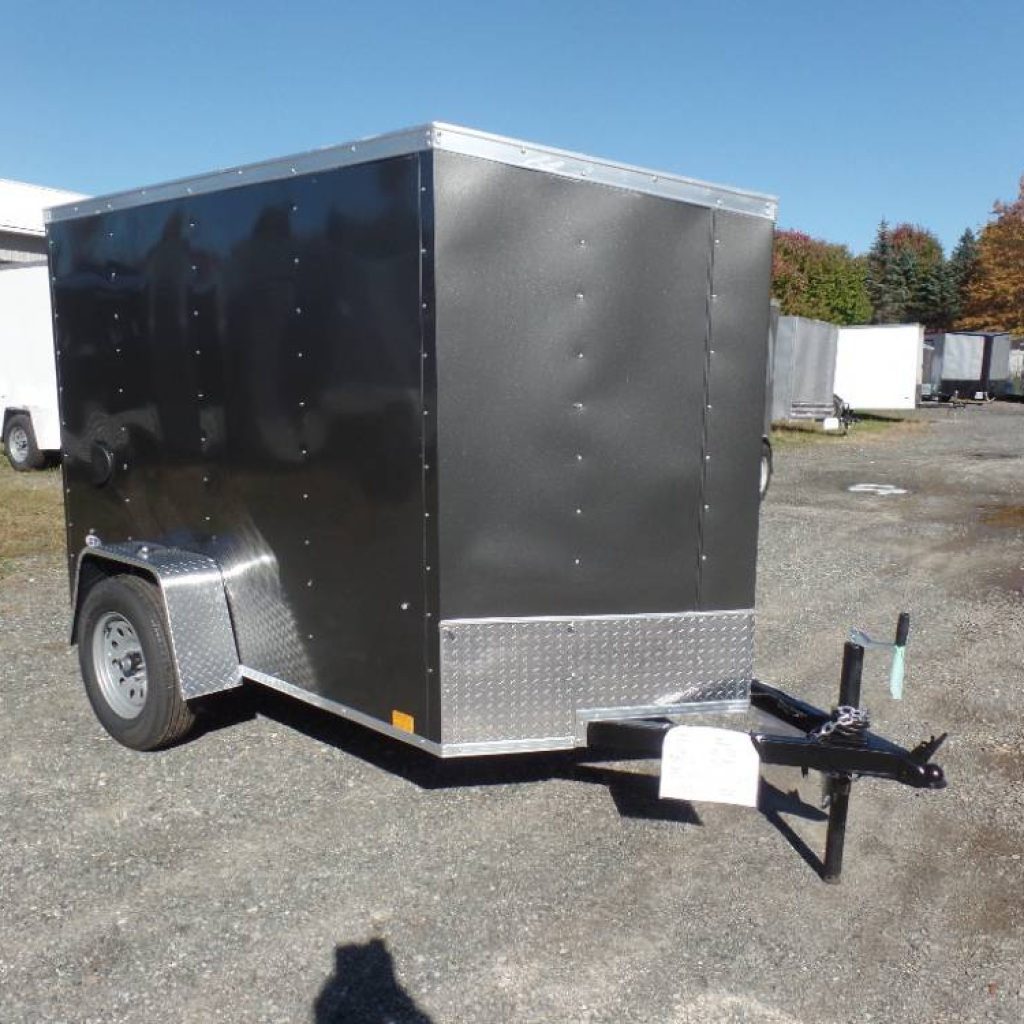 Enclosed Trailer 5X8 with 5 1/2 ' interior height , single axle, side hinged door on back.
