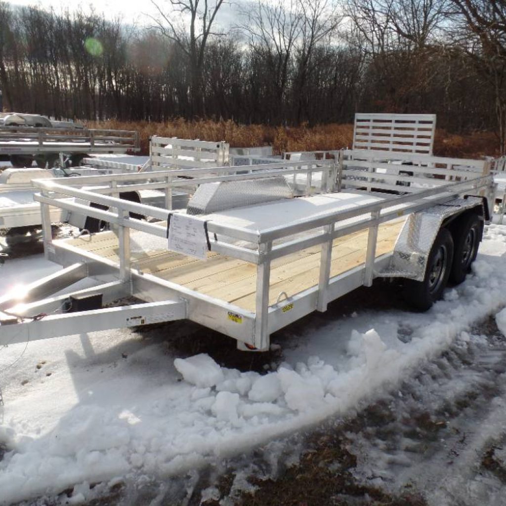 Utility trailer, 7 X 14, aluminum frame, wood deck, ramp, side railings, 7,000 lb. GVWR , lightweight 1,580 lbs. empty, electric brakes