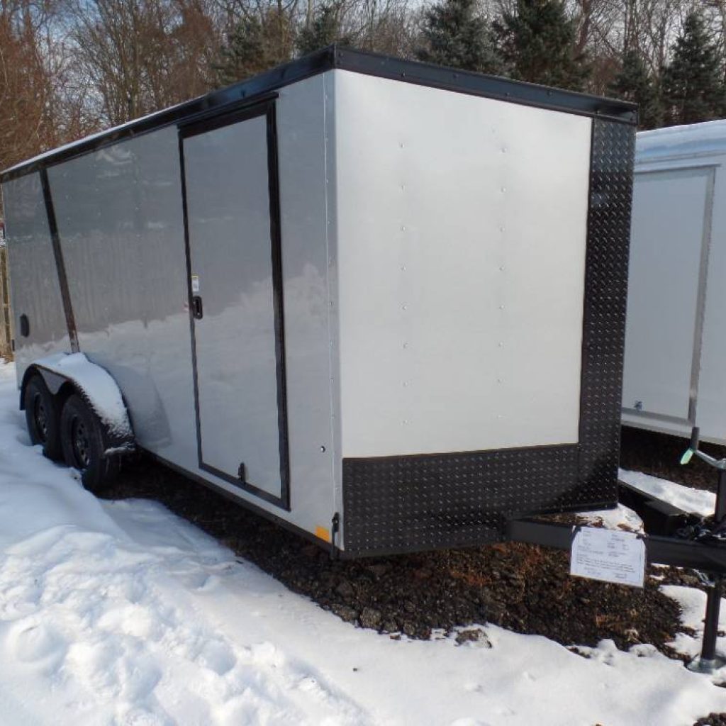 Enclosed Cargo Trailer, 7X14 with 6 1/2 ft interior height, black trim, 7,000 lb. GVWR, ramp with spring assist, side door.