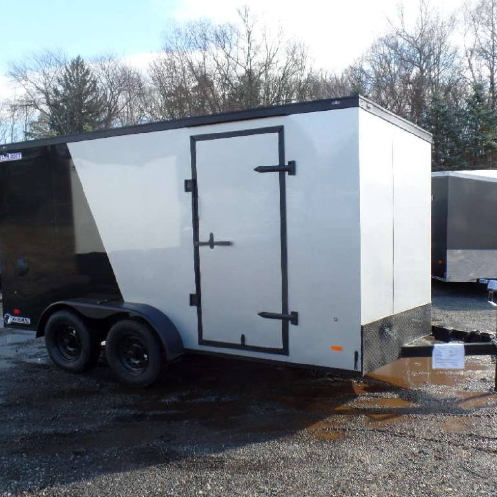 7x14-enclosed with black-out trim package, sharp looking trailer Haul About Cougar Model. 7,000 lb. GVWR , ramp on back, side door.