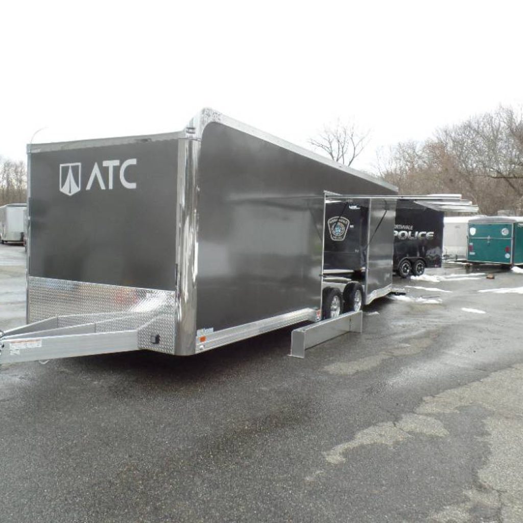 8.5X24 ATC Enclosed Car Trailer, with Premium Escape Door with Removable Fender, all aluminum frame, finished interior, options !  Cabinets, Lighting, Electrical Package. Big Escape Door with Removable Fender allows easy exit from your vehicle.
