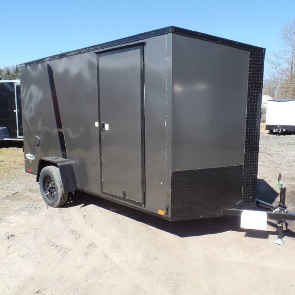 6X12 Enclosed Trailer, Gray with Black Trim, screwless exterior, 2,990 lb. GVWR, 1,465 lbs. empty weight, one piece aluminum roof. Ramp door, side door, RV latch, 15