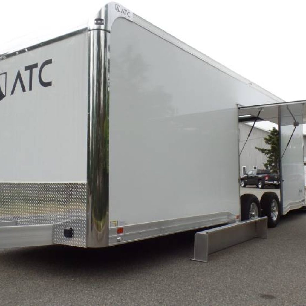 ATC Brand, New RM500 series enclosed car trailer with premium escape door with removable fender, finished interior.  BEST PRICE
