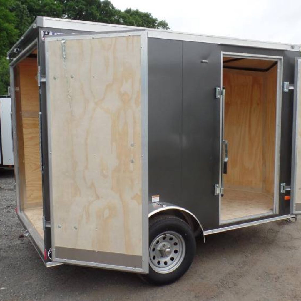 6X10 Enclosed Cargo Trailer, Double Doors on back, stabilizer jacks under the back, 2,990 GVWR, 6'6