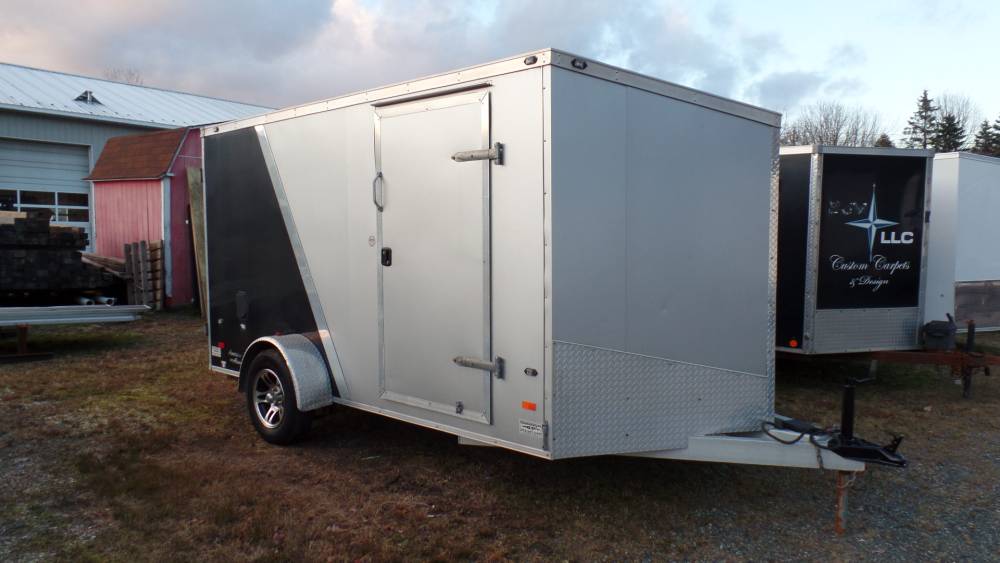 USED, 7X12 V nose enclosed trailer, Aluminum Frame, Ramp Door, Side Door, 3,500 lb. GVWR, Electric Brakes, Aluminum Rims.  e track installed on floor ,set up to carry a motorcycle ( with optional accessories.)