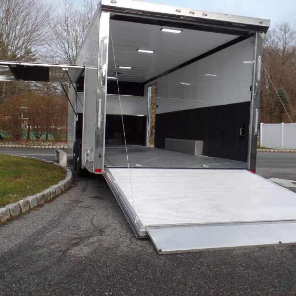 ATC 8.5CX24 Model ROM500 top model Extruded Aluminum Floor, Deluxe Package, Loaded, Cabinets, Electrical, Premium Escape Door with Removable Fender, Rear Wing,, Perimeter Skirting, Carpet on walls, Recessed Aluminum airline Track in Floor, Torsion Axles, Aluminum Frame, 9,990 lb. GVWR,  ATC Brand, RM500 8.5X24 enclosed car trailer, top model, all aluminum frame, extruded aluminum floor, finished interior, big escape door