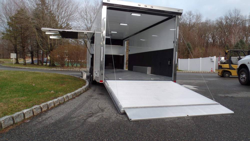 ATC 8.5CX24 Model ROM500 top model Extruded Aluminum Floor, Deluxe Package, Loaded, Cabinets, Electrical, Premium Escape Door with Removable Fender, Rear Wing,, Perimeter Skirting, Carpet on walls, Recessed Aluminum airline Track in Floor, Torsion Axles, Aluminum Frame, 9,990 lb. GVWR,  ATC Brand, RM500 8.5X24 enclosed car trailer, top model, all aluminum frame, extruded aluminum floor, finished interior, big escape door