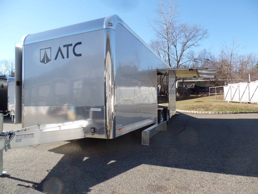 ATC Brand 8.5X24 enclosed car trailer, Coin Floor Plus Package, Airline Track in floor, Finished Interior, Cabinets, Premium Escape Door with removable fender, 9,990 lb. GVWR, 50 amp electric, black coin rubber floor, end of season sale.